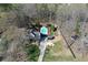 Aerial view of the property showcasing pool, home, outbuildings, and landscaping at 158 Lambeth Dr, Hiram, GA 30141