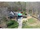 Scenic aerial view of the property featuring a well-maintained home, pool, and expansive yard at 158 Lambeth Dr, Hiram, GA 30141