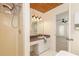 Bright bathroom featuring a vanity with decorative countertops, shower, and connection to bedroom at 158 Lambeth Dr, Hiram, GA 30141