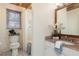 Well-lit bathroom with wood ceiling, sink with granite countertops, and a shower and tub combo at 158 Lambeth Dr, Hiram, GA 30141