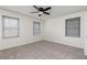 Bedroom featuring neutral carpet, blinds, ceiling fan with light fixture and a double hung window at 158 Lambeth Dr, Hiram, GA 30141