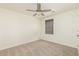 Bright bedroom featuring neutral carpet, a fan, and ample natural light perfect for peaceful relaxation at 158 Lambeth Dr, Hiram, GA 30141