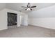 Spacious bedroom features neutral carpet, fan, and walk-in closet perfect for comfortable living at 158 Lambeth Dr, Hiram, GA 30141