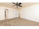 Spacious bedroom featuring neutral carpet, fan, and double door closet perfect for comfortable living at 158 Lambeth Dr, Hiram, GA 30141