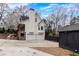 View highlighting the home's rear exterior, showcasing the two-car garage and private setting at 158 Lambeth Dr, Hiram, GA 30141