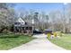 Exterior showcasing the home's curb appeal, long drive, and charming front porch at 158 Lambeth Dr, Hiram, GA 30141