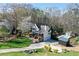 Beautiful two-story home with a pool and well-manicured lawn surrounded by lush trees at 158 Lambeth Dr, Hiram, GA 30141