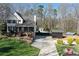 Charming two-story home with a welcoming front porch, a pool, and well-kept landscaping at 158 Lambeth Dr, Hiram, GA 30141