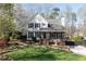 Charming two-story home with landscaped front yard, covered porch and blooming tree at 158 Lambeth Dr, Hiram, GA 30141