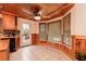 Eat-in kitchen area featuring a wood ceiling, large windows, and access to the back deck at 158 Lambeth Dr, Hiram, GA 30141