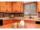 Close up of a kitchen island with a view of the countertop, cabinets, and modern faucet at 158 Lambeth Dr, Hiram, GA 30141