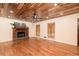 Spacious living room with hardwood floors, fireplace, and wood plank ceiling at 158 Lambeth Dr, Hiram, GA 30141
