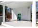 White pool house, complete with double doors, sits on a concrete deck, and is adjacent to trees at 158 Lambeth Dr, Hiram, GA 30141