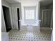 Bathroom featuring a separate tub, shower, and large window at 1822 Hayden Mill Ct, Lawrenceville, GA 30043
