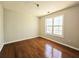 Bedroom with hardwood floors and a window for natural light at 1822 Hayden Mill Ct, Lawrenceville, GA 30043