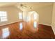 Large bedroom with hardwood floors and multiple windows for natural light at 1822 Hayden Mill Ct, Lawrenceville, GA 30043