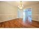 Elegant dining room with hardwood floors and chandelier at 1822 Hayden Mill Ct, Lawrenceville, GA 30043