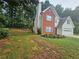 Charming two-story home with a brick and siding exterior, manicured lawn, and an attached two-car garage at 1822 Hayden Mill Ct, Lawrenceville, GA 30043