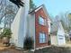 Two-story home showcasing a red brick section and a white siding at 1822 Hayden Mill Ct, Lawrenceville, GA 30043