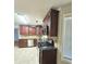 Updated kitchen featuring granite countertops and wooden cabinets at 1822 Hayden Mill Ct, Lawrenceville, GA 30043