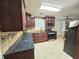 Updated kitchen with stainless steel appliances and dark wood cabinetry at 1822 Hayden Mill Ct, Lawrenceville, GA 30043