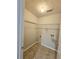 Functional laundry room with wire shelving and tile flooring at 1822 Hayden Mill Ct, Lawrenceville, GA 30043