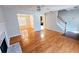 Open living area with hardwood floors leading to dining room and staircase at 1822 Hayden Mill Ct, Lawrenceville, GA 30043