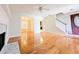 Bright living room with hardwood floors, fireplace, and a ceiling fan at 1822 Hayden Mill Ct, Lawrenceville, GA 30043