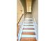 Staircase featuring hardwood steps and white railings at 1822 Hayden Mill Ct, Lawrenceville, GA 30043