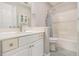 Bright bathroom with a shower-tub combination and a classic vanity at 2275 Holly Run Dr, Jonesboro, GA 30236