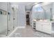 Bright bathroom featuring a glass shower, a walk-in closet, a sink with white cabinets and light blue walls at 2275 Holly Run Dr, Jonesboro, GA 30236