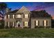 Charming two-story home features a landscaped front yard, black shutters, and a classic facade at 2275 Holly Run Dr, Jonesboro, GA 30236