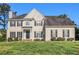Charming two-story home features a landscaped front yard, black shutters, and a classic facade at 2275 Holly Run Dr, Jonesboro, GA 30236