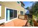 A wooden deck with sliding glass door that leads to the backyard at 3876 Toccoa Falls Dr, Duluth, GA 30097
