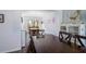 Cozy dining room featuring hardwood floors, wainscoting, an elegant chandelier, and large windows at 3876 Toccoa Falls Dr, Duluth, GA 30097