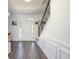 Welcoming foyer with hardwood flooring, staircase with decorative iron railing, and bright natural light at 3876 Toccoa Falls Dr, Duluth, GA 30097