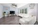 Spacious living room with ample natural light, featuring modern furnishings and decor at 3876 Toccoa Falls Dr, Duluth, GA 30097