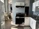 Open kitchen featuring stainless steel appliances, white cabinetry, and a view into the living area at 20 Marietta Nw St # 10E, Atlanta, GA 30303