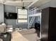 Comfortable living room featuring ample natural light, a ceiling fan, and flexible furniture at 20 Marietta Nw St # 10E, Atlanta, GA 30303