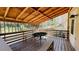 Comfortable covered deck with views of wooded back yard, perfect for outdoor entertaining at 494 Rue Montaigne, Stone Mountain, GA 30083