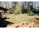 Spacious backyard with a deck, mature trees, and ample space for outdoor activities at 494 Rue Montaigne, Stone Mountain, GA 30083
