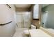 Bathroom with tiled floors, shower and tub combo, toilet, and vanity at 494 Rue Montaigne, Stone Mountain, GA 30083