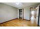 Bedroom featuring hardwood floors, a ceiling fan, and closet at 494 Rue Montaigne, Stone Mountain, GA 30083