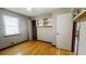 Bedroom with hardwood floors, built-in shelving, and closet space at 494 Rue Montaigne, Stone Mountain, GA 30083