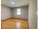 Bright bedroom with hardwood floors and a window bringing in natural light at 494 Rue Montaigne, Stone Mountain, GA 30083