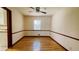 Dining room with hardwood floors, ceiling fan and natural light from the window at 494 Rue Montaigne, Stone Mountain, GA 30083