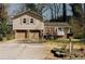 Charming two-story home featuring a two-car garage and cozy front porch at 494 Rue Montaigne, Stone Mountain, GA 30083