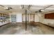 Attached garage with overhead lighting and shelves for storage, offering convenience and organization at 494 Rue Montaigne, Stone Mountain, GA 30083