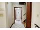 Hallway with tile floors leading to the front door and staircase at 494 Rue Montaigne, Stone Mountain, GA 30083
