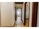 Hallway with hardwood floors and views into other rooms at 494 Rue Montaigne, Stone Mountain, GA 30083